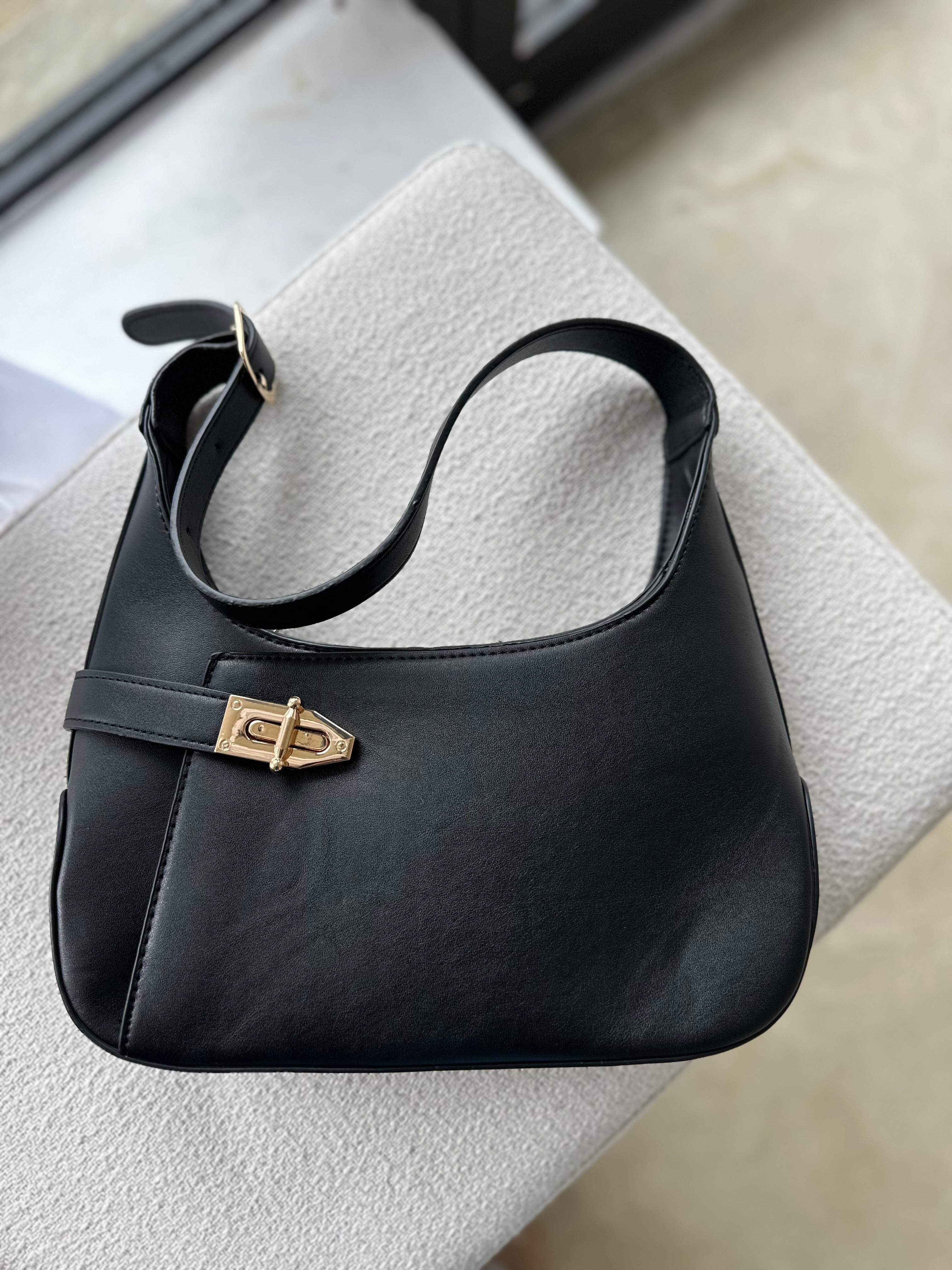 The Luxe Lock Shoulder Bag