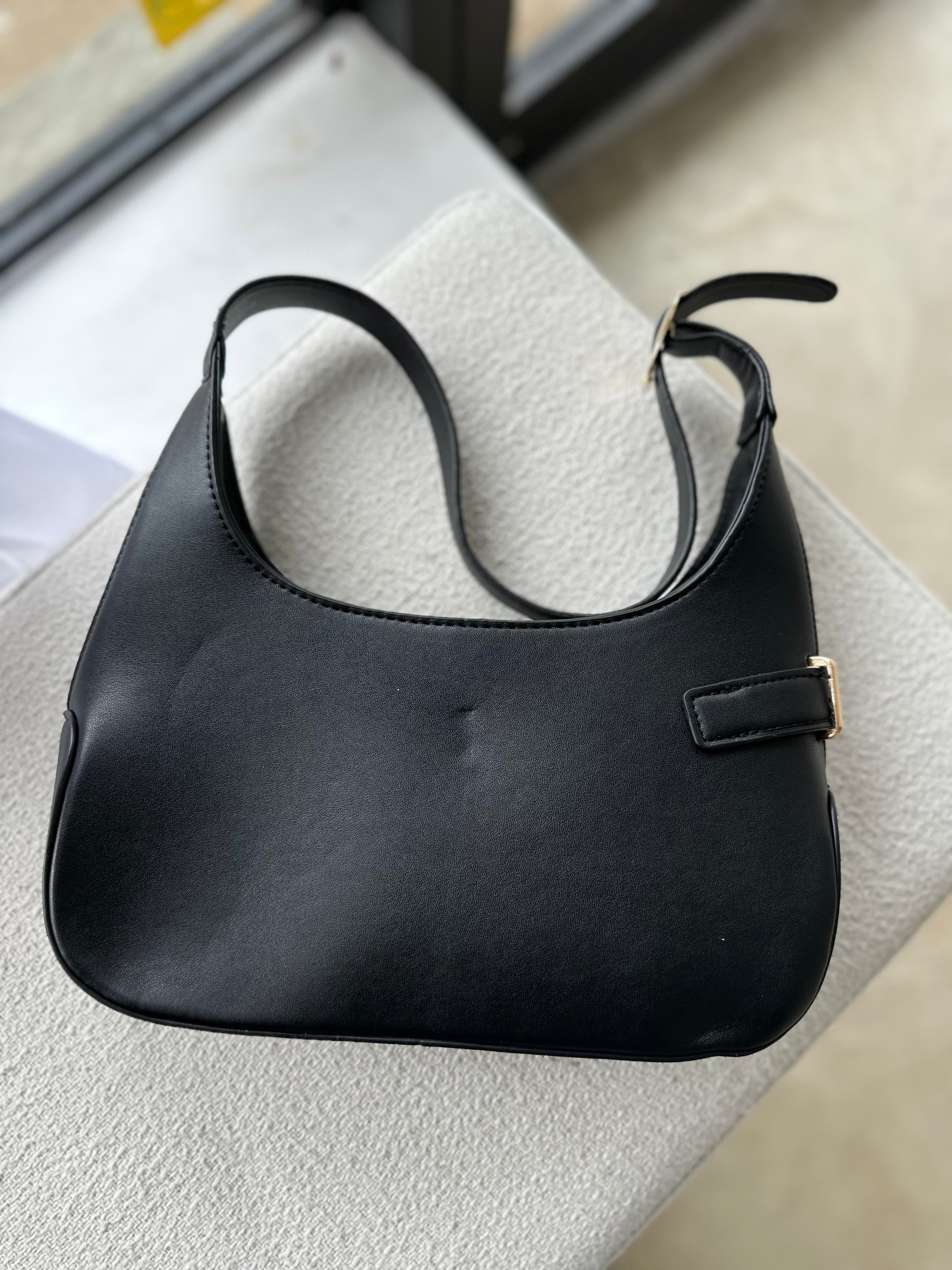 The Luxe Lock Shoulder Bag